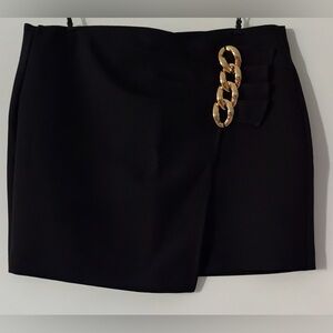 Elegant Black Skort with Gold Chain Detail. small. Brand: Mango. Never worn.